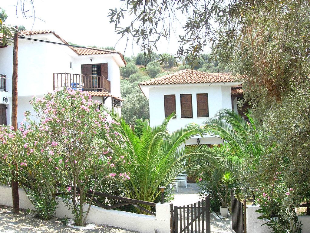 Galateia buildings among palms and oleanders